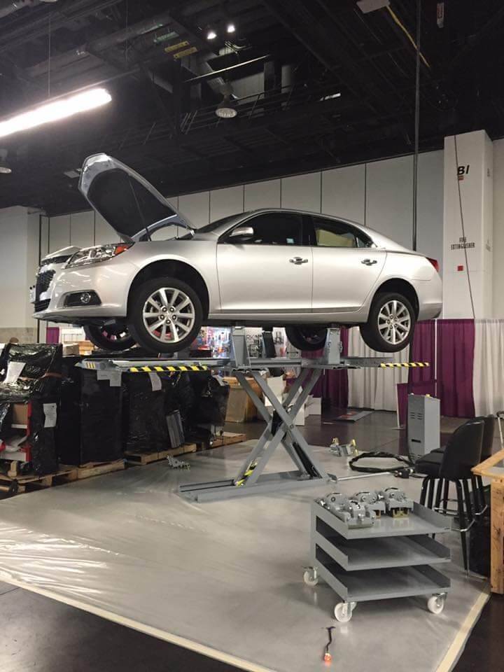 man repairing car